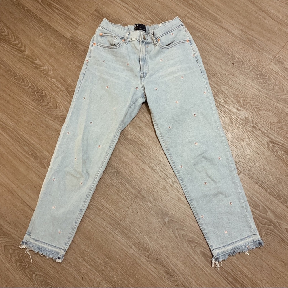Light wash girlfriend jeans with embroidered flowers